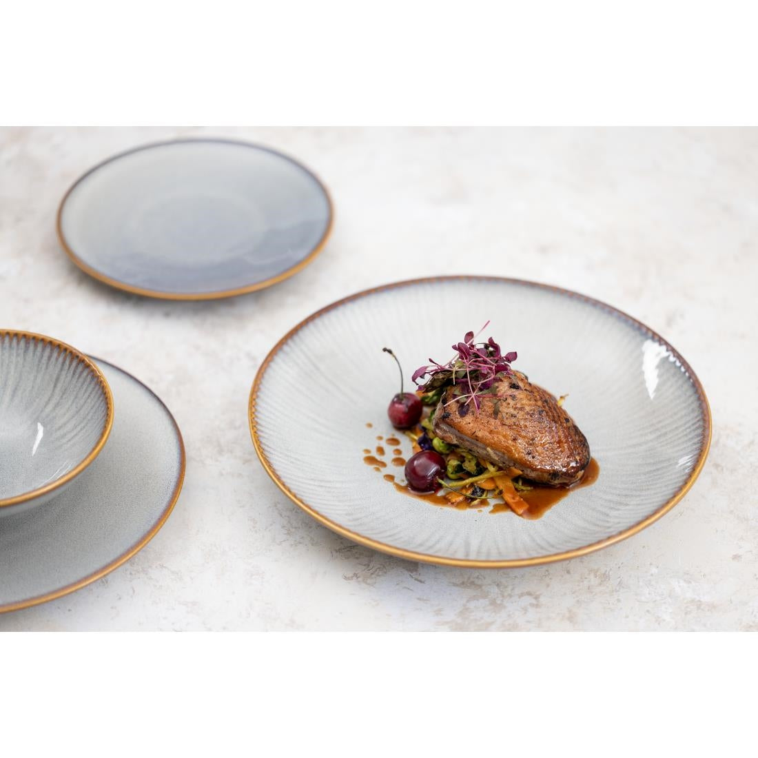 Assiettes creuses Olympia Drift en relief gris 260 mm (lot de 4)